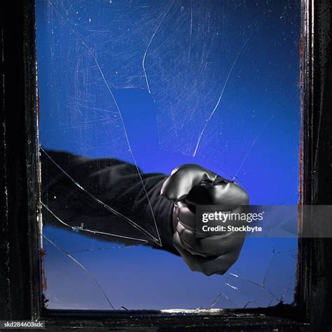 Fist Breaking Glass Photos And Premium High Res Pictures Getty Images