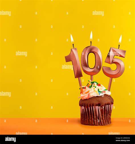 Candle With Flame Number 105 Birthday Card On Yellow Background Stock