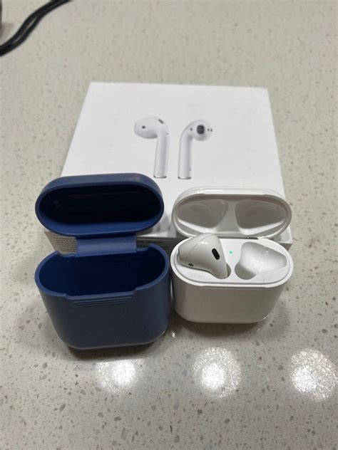 Apple Airpod Gen 2 Charging Case And Left Airpod Audio Earphones On