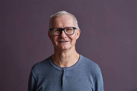 Premium Photo Minimal Portrait Ot Of Senior Man Wearing Glasses And