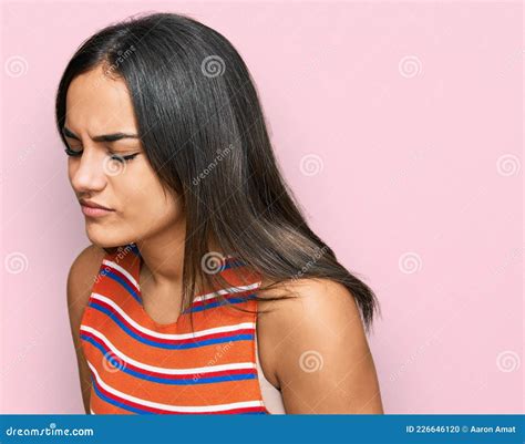 Young Brunette Woman Wearing Casual Clothes With Hand On Stomach