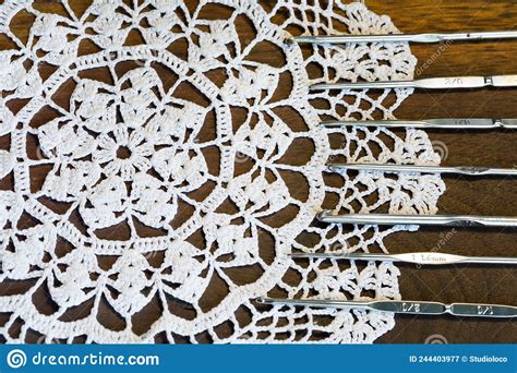 Set Of Crochet Hooks Lying On A Lace Doily Stock Image Image Of