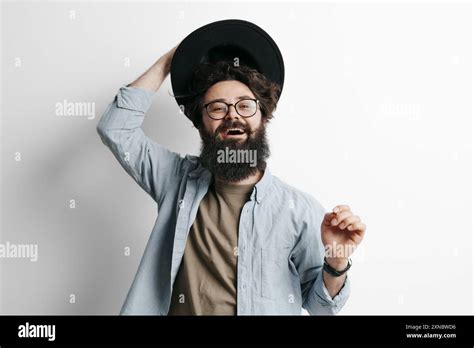 cheerful bearded man tipping  hat  greeting stock photo alamy