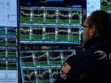 Nasdaq soars above 20,000 for the first time as stocks jump on rate-cut ...