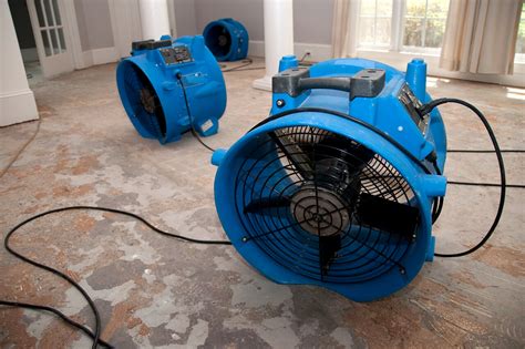 Industrial Fans Used To Dry Floor Of Water Damaged Home