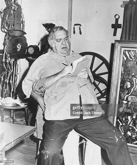 View Of American Actor And Comedian Zero Mostel As He Sits On The Lap