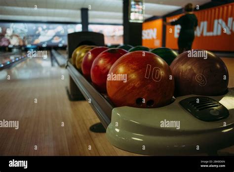 Multi Colored Bowling Balls On The Background Of The Tracks Stock Photo