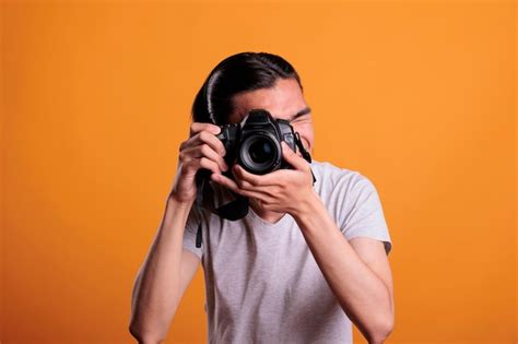 Premium Photo Photographer Taking Photos On Professional Dslr Camera