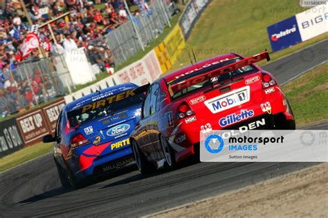 Marcos Ambrose Aus Pirtek Ford Falcon Leads Mark Skaife Aus Hrt