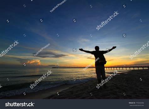 Silhouette Man Hands Raised Beautiful Sunrise Stock Photo