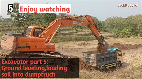 Excavator Doosan DX 225 LCA Ground Leveling Loading Soil Into Dumptruck