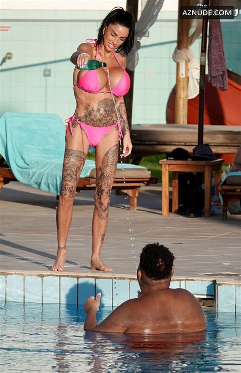 Katie Price Sexy Spotted Showing Off Her Busty Assets Wearing A Sultry Pink Bikini At A Pool In