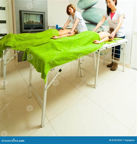 Massage With Hot Rocks Stones In Beautician Stock Photo Image Of