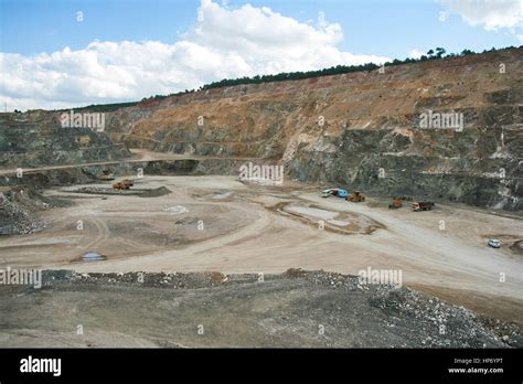 Bottom Of Surface Mining And Machinery In An Open Pit Mine Stock Photo