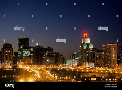 SKYLINE OF ST. PAUL, MINNESOTA AT DUSK WITH MOVING LIGHTS OF TRAFFIC ...