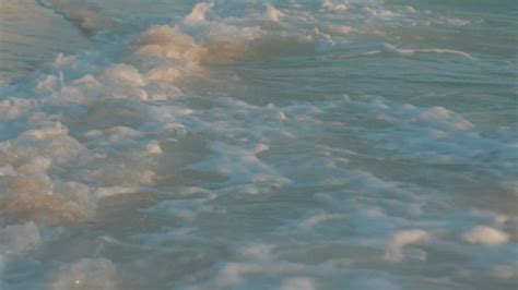 Turquoise Ocean Waves Roll In On Sandy Beach Stock Footage Sbv