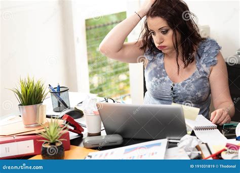 Overworked Businesswoman Sitting At A Messy Desk Stock Image Image Of Business Frustrated