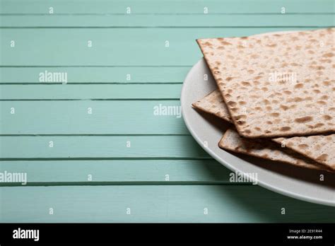 Plate With Jewish Flatbread Matza For Passover On Wooden Background