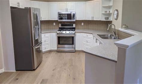 Light brown floors | Brown floors, Kitchen cabinets, Flooring