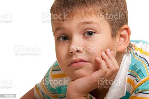 Portrait Of A Sad Boy With Big Grey Eyes Stock Photo Download Image