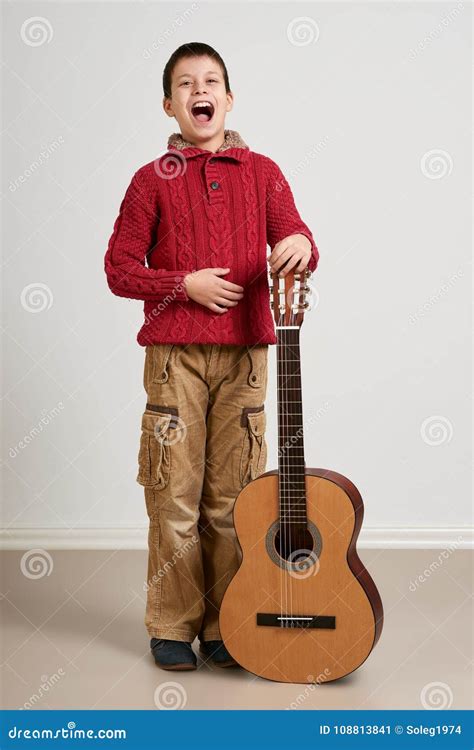 Boy Having Fun with Guitar, Making Music and Singing Stock Image ...