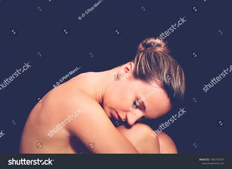 Nude Woman Curled On Black Background Stock Photo 1482753437 Shutterstock