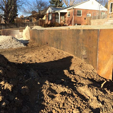 Corten steel retaining wall almost set. Installed by Industrial Luxury ...