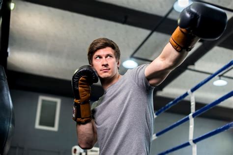 Free Photo | Boxer boy posing at the gym