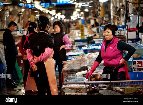 Vendors Working At The Noryangjin Fish Market In Seoul Democratic