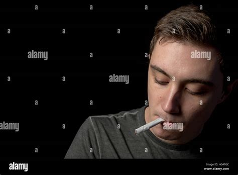 Teenage Boy Smoking Stock Photo - Alamy