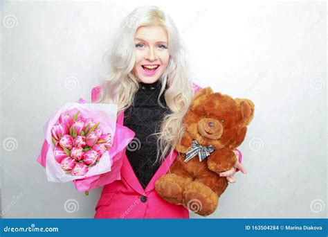 Tender Pretty Blonde Slim Teen Girl With Pink Flowers Cheerful Woman With Fresh Bouquet Stock