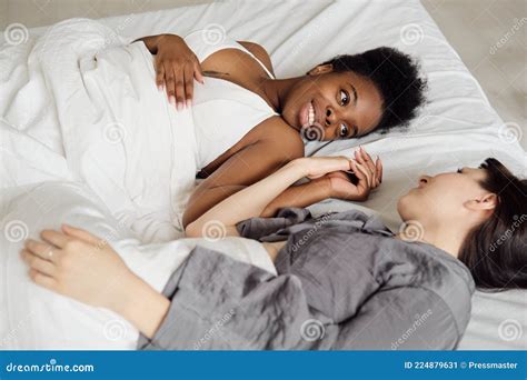 Lesbian Couple Relaxing In Bed Under Blanket Stock Image Image Of Cheerful Together