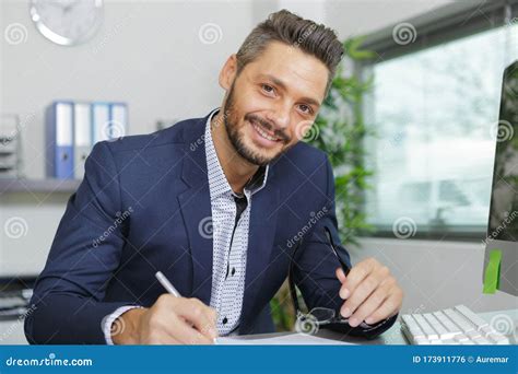 Male Office Worker Writing Something Stock Photo Image Of