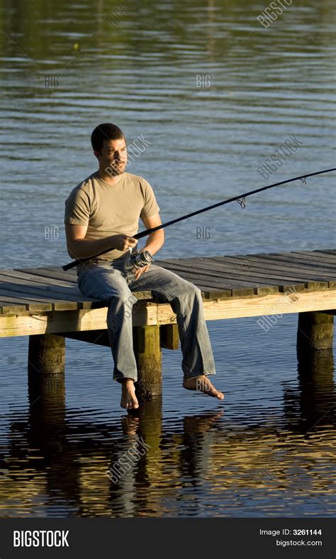 Man Fishing Off Dock Image Photo Bigstock