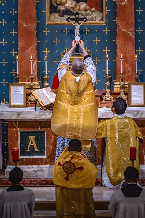 Priest Holding The Eucharist During Traditional Latin Mass Catholic