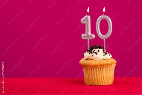 Birthday cake with candle number 10 - Rhodamine Red foamy background ...