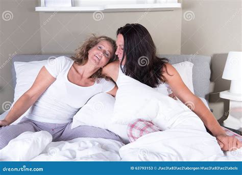 Two Attractive Women Hugging Each Other In Bed Stock Image Image Of