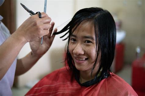 Barber Getting Ready To Cut His Client Hair At Barbershop Stock Photo