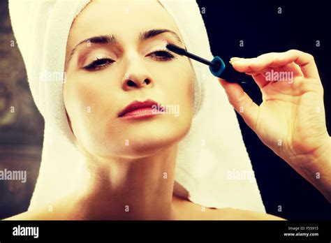 Woman Makes Light Day Makeup In Bathroom Stock Photo Alamy