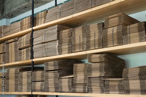 empty cardboard boxes on the shelves of warehouse Stock Photo | Adobe Stock