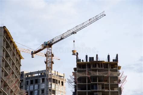 Preparing To Pour A Bucket Of Concrete Into Formworktower Crane