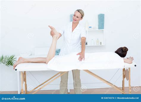 Physiotherapist Doing Leg Massage Stock Photo Image Of Lying