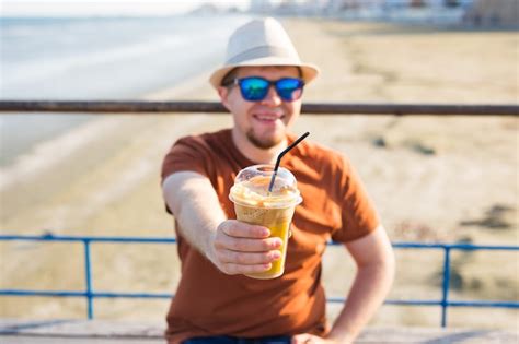 Premium Photo Portrait Of Smiling Man Holding Ice Cream