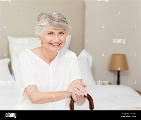 Retired Woman With Her Walking Stick Stock Photo Alamy