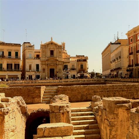 An Old City With Stone Steps And Buildings