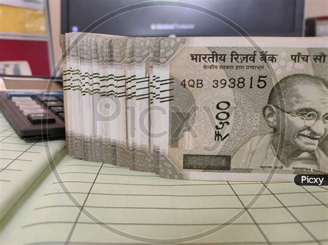 Image Of Indian Currency Rupee 500 Bundle Kept On Cashbook With