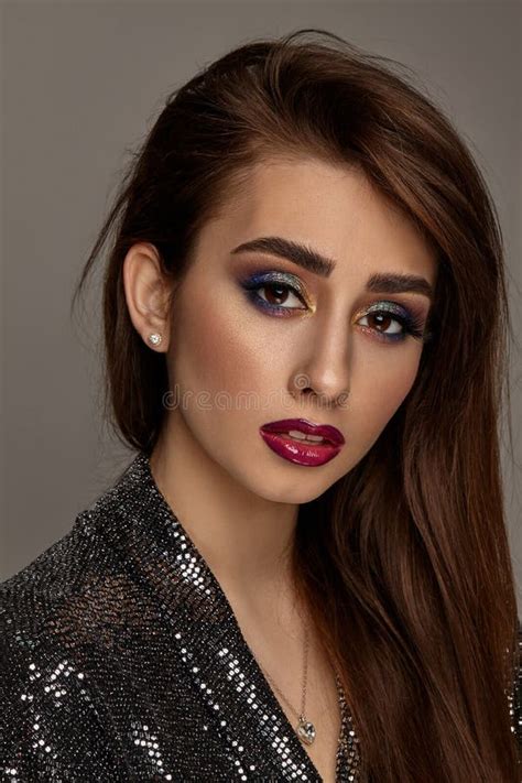 Brunette Naked Woman In Jewelry Posing On Gray Studio Background Luxury Makeup Colorful