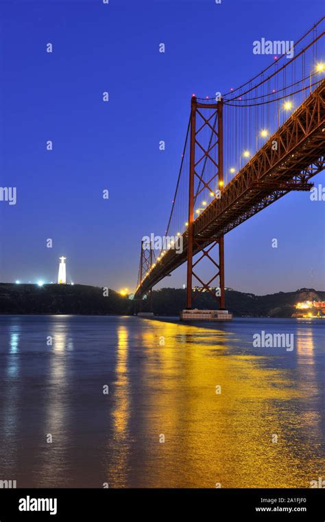 Tagus River And 25th April Bridge Near The Statue Of Christ The King