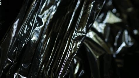 Rotation Of Wrinkled Crumpled Packaging Film Black Background Made Of