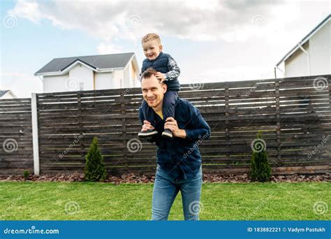 Father Carrying Baby Son On The Shoulders Outdoors Stock Image Image